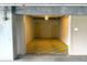 View of the inside of the unit's garage with tiled floor at 4561 Olde Perimeter Way # 702, Atlanta, GA 30346