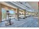 Well-equipped gym with treadmills, ellipticals, and large windows at 4561 Olde Perimeter Way # 702, Atlanta, GA 30346