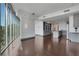 Open floor plan with hardwood floors, large windows, and a modern kitchen at 4561 Olde Perimeter Way # 702, Atlanta, GA 30346