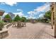 Outdoor brick patio area with seating surrounded by well-maintained landscaping at 4561 Olde Perimeter Way # 702, Atlanta, GA 30346