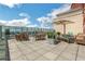 Relaxing outdoor terrace with dining and lounge seating and city views at 4561 Olde Perimeter Way # 702, Atlanta, GA 30346