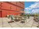 Relaxing outdoor terrace with dining and lounge seating and partial city views at 4561 Olde Perimeter Way # 702, Atlanta, GA 30346