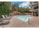 Beautiful outdoor pool area with lounge chairs and lush landscaping at 4561 Olde Perimeter Way # 702, Atlanta, GA 30346