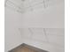 White wire shelving creates an organized space inside this walk-in closet at 4561 Olde Perimeter Way # 702, Atlanta, GA 30346