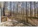 Outside deck overlooking a tranquil wooded area offering serene privacy at 55 Legend Creek Cove, Douglasville, GA 30134