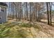 View of spacious backyard from the side of the house at 55 Legend Creek Cove, Douglasville, GA 30134