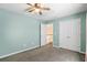 Bright bedroom features a standard closet and natural light from the open doorway at 55 Legend Creek Cove, Douglasville, GA 30134