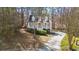 Charming curb appeal with a long driveway and a covered front porch at 55 Legend Creek Cove, Douglasville, GA 30134