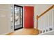 View of the front door, wood floors, and an open view of the neighborhood at 55 Legend Creek Cove, Douglasville, GA 30134