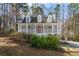 Charming two-story home with a welcoming front porch and well-maintained landscaping at 55 Legend Creek Cove, Douglasville, GA 30134