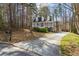 Charming two-story home with a front porch, driveway, and mailbox at 55 Legend Creek Cove, Douglasville, GA 30134