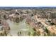 Scenic aerial view of the lake with houses in the community around it at 55 Legend Creek Cove, Douglasville, GA 30134