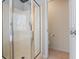 This tiled shower features a glass door, window, and chrome hardware at 55 Legend Creek Cove, Douglasville, GA 30134