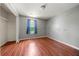 Bedroom with hardwood floor and a window with curtains at 125 Fairhaven Trl, Fairburn, GA 30213