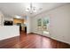 Dining area features hardwood floors and access to the outdoor deck through French doors at 125 Fairhaven Trl, Fairburn, GA 30213