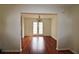 View of dining room area featuring a hardwood floor and natural light at 125 Fairhaven Trl, Fairburn, GA 30213