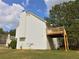 Exterior view of home with second-story wooden deck and chimney at 125 Fairhaven Trl, Fairburn, GA 30213