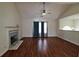 Spacious living room with vaulted ceiling, fireplace, and large windows at 125 Fairhaven Trl, Fairburn, GA 30213