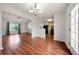 Inviting living space with hardwood floors seamlessly connects to the kitchen at 125 Fairhaven Trl, Fairburn, GA 30213