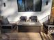 Cozy backyard deck with a stylish fire pit and comfortable lounge chairs, ideal for cool evenings at 245 Mathewson Pl, Atlanta, GA 30314