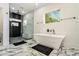 Elegant bathroom with a modern tub, glass-enclosed shower, and marble floors, creating a spa-like retreat at 245 Mathewson Pl, Atlanta, GA 30314