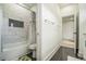 Modern bathroom featuring a tub with shower, and white subway tile, creating a clean and functional space at 245 Mathewson Pl, Atlanta, GA 30314