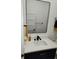 Modern bathroom with a sleek mirror and black hardware at 245 Mathewson Pl, Atlanta, GA 30314