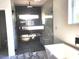 Modern bathroom with a glass enclosed shower and marble floors at 245 Mathewson Pl, Atlanta, GA 30314