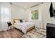 Bright bedroom with modern furnishings and a large window offers a comfortable and stylish living space at 245 Mathewson Pl, Atlanta, GA 30314