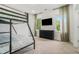 Cozy bedroom with a bunk bed, large window and TV, creating a welcoming retreat at 245 Mathewson Pl, Atlanta, GA 30314