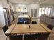 Spacious dining area and kitchen with stainless steel appliances and a large center island at 245 Mathewson Pl, Atlanta, GA 30314