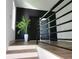 Stylish entryway with a staircase, plant, and modern black accents at 245 Mathewson Pl, Atlanta, GA 30314