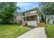 Charming two-story home with modern architectural features, a manicured lawn, and a welcoming front porch at 245 Mathewson Pl, Atlanta, GA 30314