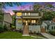 Modern two-story home with a covered porch, landscaped yard, and wooden steps leading to the entrance at 245 Mathewson Pl, Atlanta, GA 30314