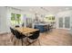 Bright kitchen featuring a center island, stainless steel appliances, modern cabinetry, and an adjacent dining area at 245 Mathewson Pl, Atlanta, GA 30314