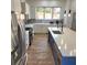 Well-lit kitchen boasts stainless steel appliances, a center island with seating, and sleek cabinetry at 245 Mathewson Pl, Atlanta, GA 30314