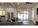 Living room with sliding glass doors to the patio, neutral paint colors and a gray sofa at 245 Mathewson Pl, Atlanta, GA 30314