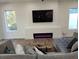 Cozy living room with linear fireplace, accent lighting, and comfortable seating at 245 Mathewson Pl, Atlanta, GA 30314