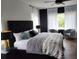 Cozy main bedroom with natural light, modern lamps and decor at 245 Mathewson Pl, Atlanta, GA 30314