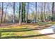 Mature trees and a play area enhance this beautiful backyard setting at 2867 Watchtower Approach Nw, Marietta, GA 30064