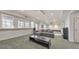 Basement living area with sofa, speaker system, and access to the remaining parts of the basement at 2867 Watchtower Approach Nw, Marietta, GA 30064