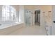 Bathroom with shower, tub, and views to the toilet room and linen closet at 2867 Watchtower Approach Nw, Marietta, GA 30064
