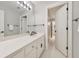 Bright bathroom featuring a large mirror, modern vanity, and access to a hallway at 2867 Watchtower Approach Nw, Marietta, GA 30064