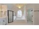 Bright bathroom featuring a large window, and separate shower and toilet rooms at 2867 Watchtower Approach Nw, Marietta, GA 30064