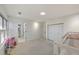 Bright bedroom featuring large windows, closet, carpet floors, and access to a hallway at 2867 Watchtower Approach Nw, Marietta, GA 30064