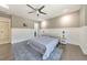 Bedroom with wood floors, a ceiling fan, and a large window for ample natural light at 2867 Watchtower Approach Nw, Marietta, GA 30064