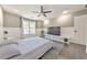 Spacious bedroom featuring wood floors, a ceiling fan, a TV, and bright natural light at 2867 Watchtower Approach Nw, Marietta, GA 30064