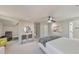 Brightly lit bedroom featuring neutral gray color, ceiling fan, modern art, sitting area and lots of natural light at 2867 Watchtower Approach Nw, Marietta, GA 30064