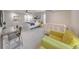 Bedroom area with large bed, seating area and crib, featuring a glass desk and large windows at 2867 Watchtower Approach Nw, Marietta, GA 30064