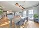 Open dining area features modern lighting fixtures, hardwood floors and easy kitchen access at 2867 Watchtower Approach Nw, Marietta, GA 30064